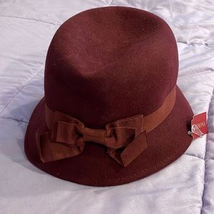 Lovely plum color hat! Wear with top pushed a little in or out.  See diameter